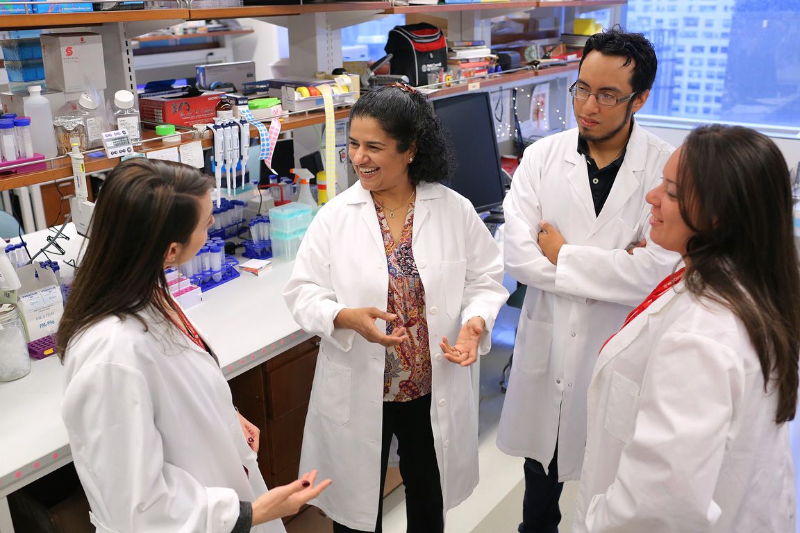 Dr. Anjali Rajadhyaksha and researchers in the lab