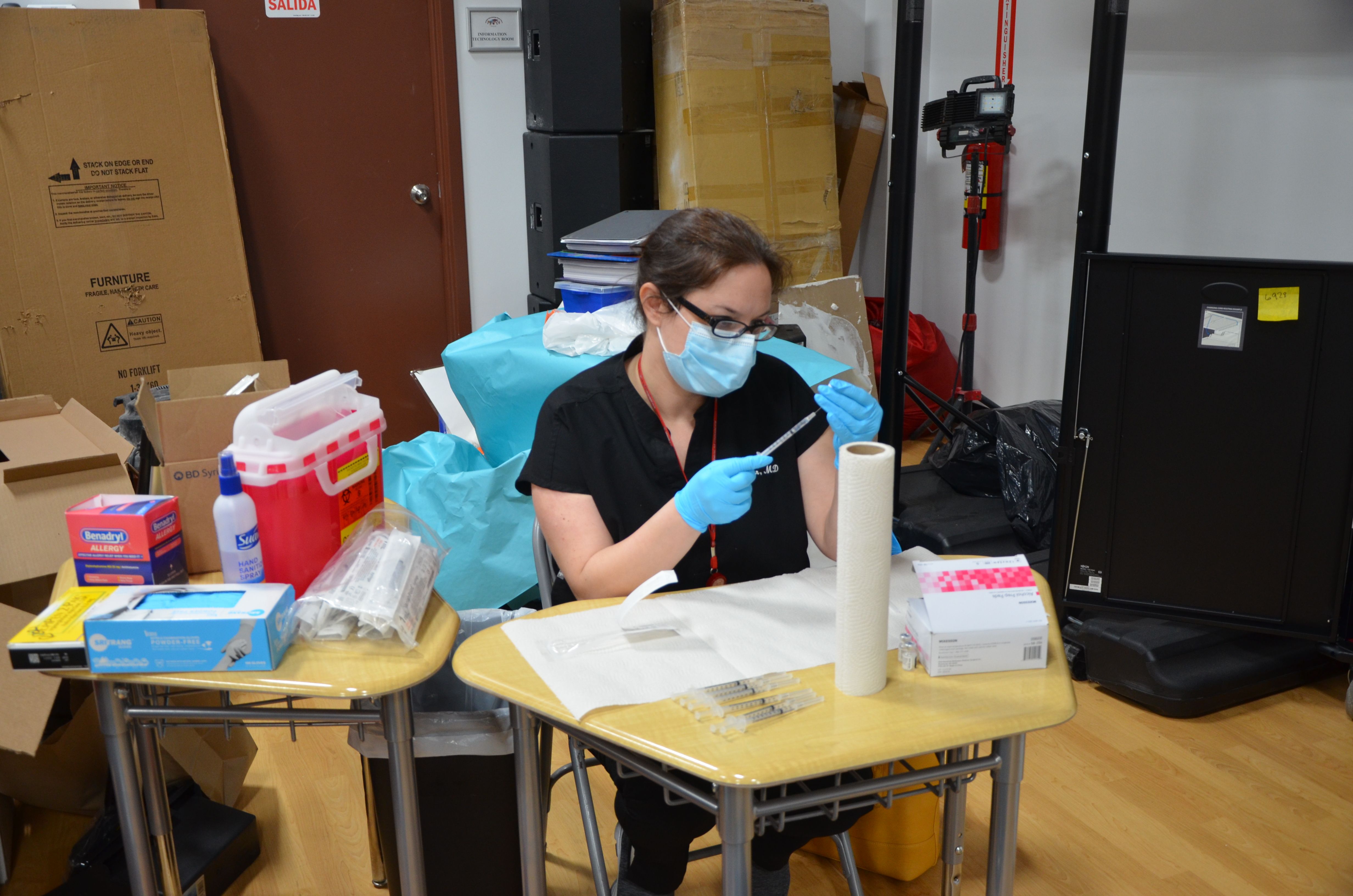 Dr. Brooke Spector prepares vaccine
